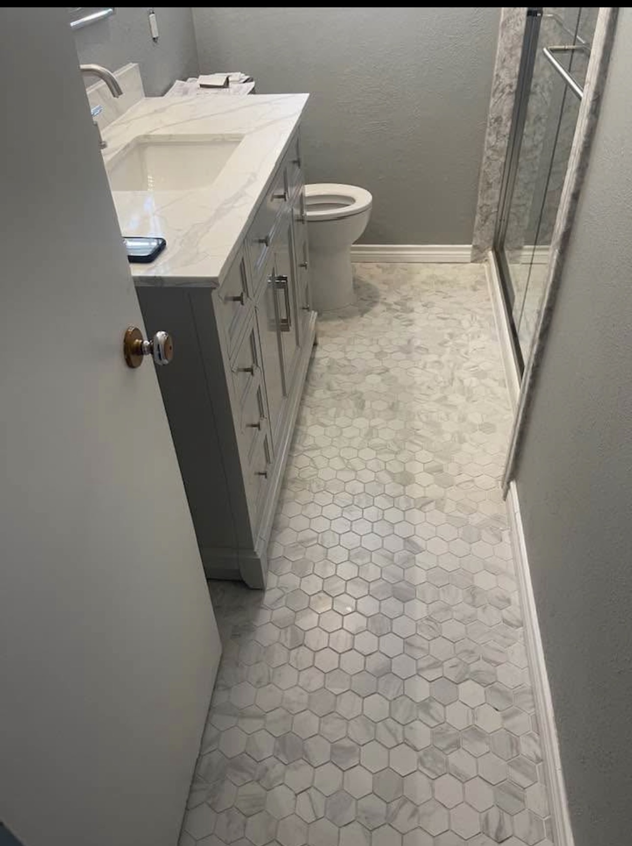 Full bathroom remodel with marble hexagon floor and Calacatta countertop — Plano TX