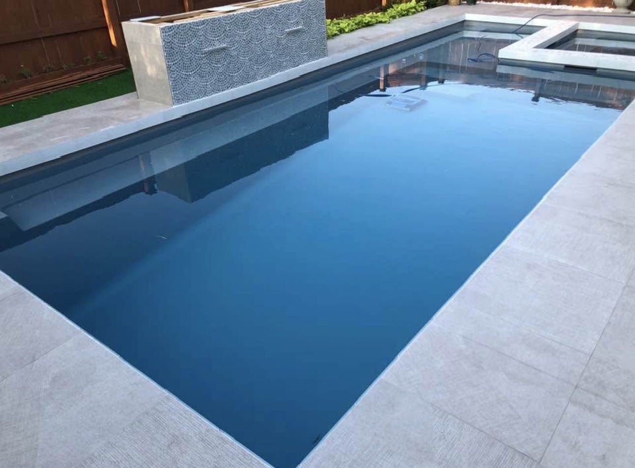 Pool deck tile installation with large format porcelain coping — DFW area