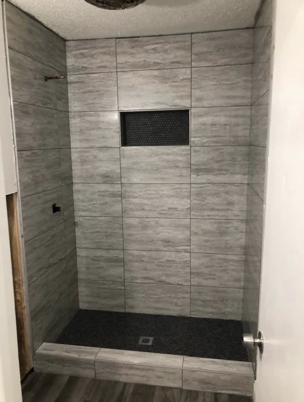 Black and white bathroom — white subway walls with black hexagon floor — Dallas TX